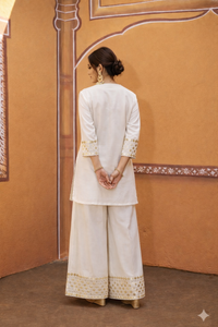 hand embroidered short cris cross kurta with pleated pants