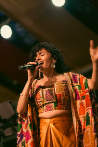Maalavika Sundar at Concert in our Liquid Gold Cape & Dhoti Set