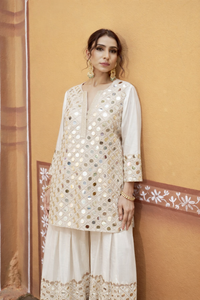 hand embroidered short cris cross kurta with pleated pants