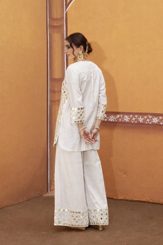 hand embroidered short cris cross kurta with pleated pants